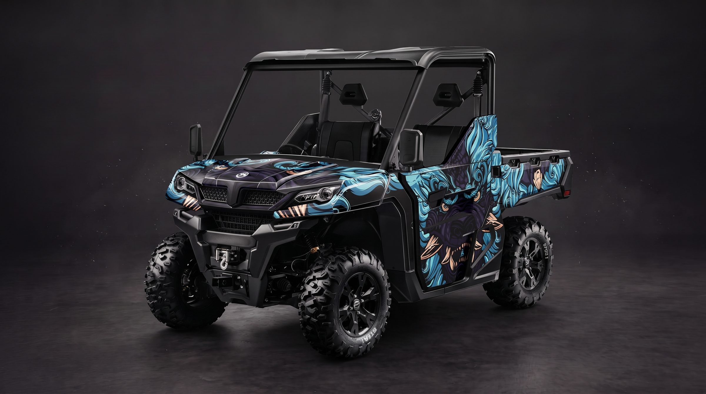 An ATV side-by-side carrying a Wraplook wrap design, blue and purple artwork running across the hood, doors and cargo bed.